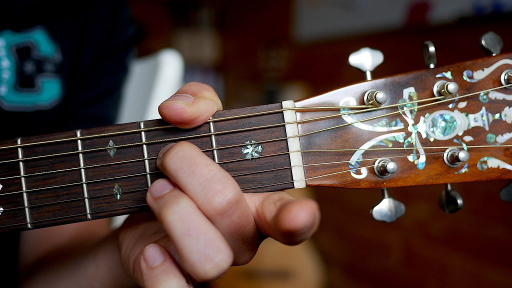 Easy Am7 Chord With Thumb Around The Neck To Mute Low E String