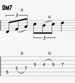 triplet motif variation over Dm7 chord showing phrasing and articulation in guitar tab